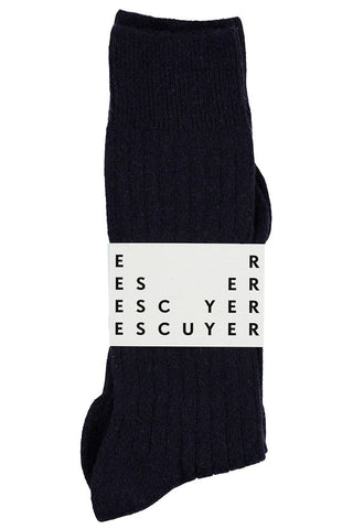 Every wardrobe needs these cozy and soft ribbed-knit socks from Escuyer. The versatile style is made from navy blue cashmere and goes up to the calves. Escuyer's socks are manufactured at a great family-owned factory in Portugal. 