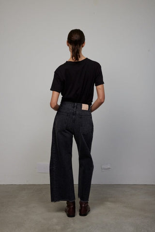 Our popular Lasso Jeans pants from B Sides are cut from heavy cotton rich denim, that has been washed way down to a matte black with a peached hand feel - then finished for a relaxed structured look. Designed to sit at the natural waist with a pieced outseam, kinked leg shape and frayed hem. This unique brand stands from high quality, sustainability and upcycling, still keeping the creations effortlessly classic, and unexpectedly sentimental.
