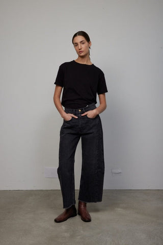Our popular Lasso Jeans pants from B Sides are cut from heavy cotton rich denim, that has been washed way down to a matte black with a peached hand feel - then finished for a relaxed structured look. Designed to sit at the natural waist with a pieced outseam, kinked leg shape and frayed hem. This unique brand stands from high quality, sustainability and upcycling, still keeping the creations effortlessly classic, and unexpectedly sentimental.
