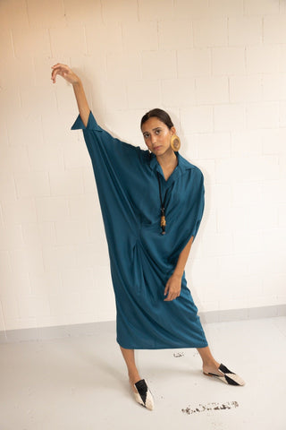 Fill your getaway suitcase with pieces from By Adushka, like this Avio Barcellona dress. Made in Italy from 100% silk, it falls slightly on the body, fitting perfectly to any body type. It features a decent collar v-neckline and it's cut to a relaxed design with batwing sleeves with elastic closure and a comfort-ensuring lining. 
