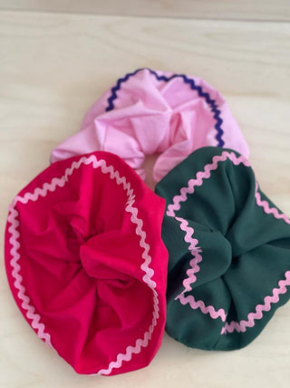 There's no better way to emulate '90s styling than with a scrunchie in your high ponytail, and By Adushka's multicolored one is our pick for this season. Our scrunchies are all about 97% up cycled since the fabric is a material that was destined for the landfill. The other 3% (or less) that’s not up cycled, is the new elastics, thread, and in some cases the labels.   They are handmade from fabric straps by our tailor in Switzerland Elif from scraps of modified items and from recycled garments.