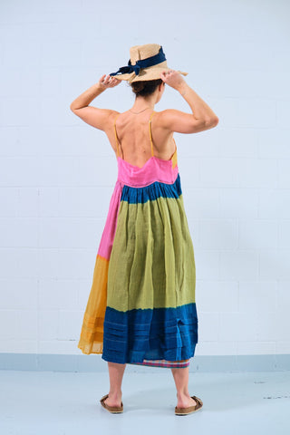 Injiri provides these super colorful slip dresses to wear alone or to accompany under another dress of the brand. Made in India from 50% cotton and 50% silk, this dress is made with the tie and dye technique and it follows the silhouette in a very soft way in the upper part and then flares out on the torso - the lower part has pleats to make the skirt wider. It features subtle shoulder straps.