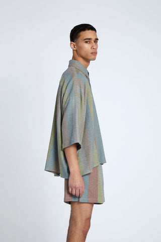 Oversized Shirts are always a great option. Our newest style addition, the Oasis Stripe Cropped Button Down Shirt, features a full button up and classic neck. The oversized shape gives a touch of modernity to this classic garment. Hand-woven in the label's Oasis Stripe, it was made to order by the local team of moroccan Artisans from 100% cotton.