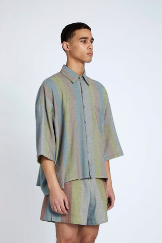 Oversized Shirts are always a great option. Our newest style addition, the Oasis Stripe Cropped Button Down Shirt, features a full button up and classic neck. The oversized shape gives a touch of modernity to this classic garment. Hand-woven in the label's Oasis Stripe, it was made to order by the local team of moroccan Artisans from 100% cotton.