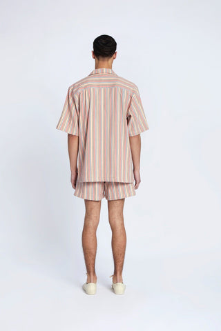 The Taroudant Camp Shirt from Marrakshi Life is a classic with a twist. It's made from pure Egyptian cotton and it features an elastic button waistband, zip fly and side seem pockets. It is hand-woven in the label's Taroudant Stripe fabric by artisans.