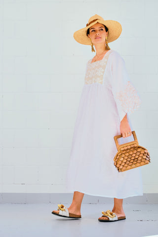 Looking for the perfect dress to take with you on your next summer getaway? Nina Leuca’s dresses are the perfect choice. Made entirely by hand from pure stone washed linen and cotton in the label’s studio in Italy - this dress features a squared neck, wide three/quarter sleeves and a slip-on silhouette. What make this dress unique are the embroidered sleeves.