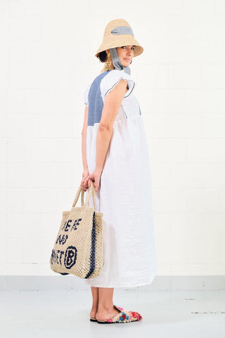 Get ready for summer with Nina Leuca’s dresses! Made in Italy from a prestigious mix of pure stone washed linen and cotton, the label’s Blue and White Midi Dress features short puff sleeves, a square neck and a blue and white hand-embroidered stitch on the frontal part. The blue colour is also reflected at the end of the sleeves.
