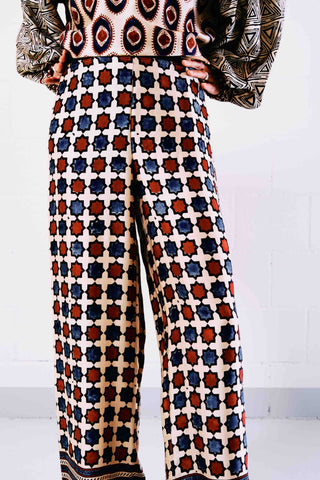 Opt for these printed pants from Obidi for the perfect spring look. Made in Italy from lightweight silk, they have high-rise wide-leg silhouette for optimum comfort on hot days. They are printed by hand with the "Blockprint" technique and the presence of indigo and rust prints gives a touch of color to this garment.