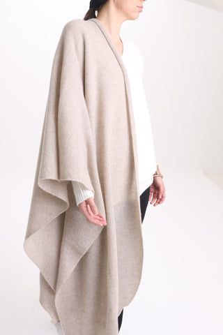 The Key Tō Dean’s Stola cape is handwoven from a pure cashmere knit. Arriving in a versatile sand hue, it’s an amazing addition to any evening gown, a wedding dress, jeans & jumper.