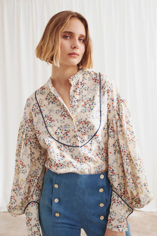 Embrace your femininity with this floral blouse from The Label Edition that offers an elegant and sophisticated look suitable for any occasion. 