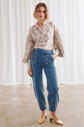 Embrace your femininity with this floral blouse from The Label Edition that offers an elegant and sophisticated look suitable for any occasion. 